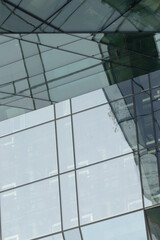 Here is a closeup view of an impressive building featuring an extensive number of windows that...