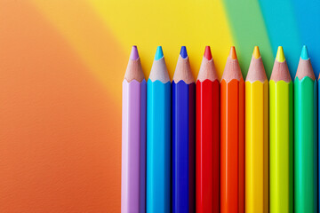 Colourful pencils on multicolored background close-up. Modern Back To School conceptual backdrop