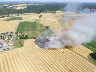 Fire in a harvested grain field in Regensburg, Bavaria, Germany.