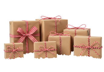 Rustic gift boxes wrapped in brown kraft paper with red and white twine bows, varied sizes, on fluffy artificial snow in the foreground, against a clean white background with copy space, christmas