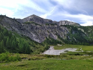 Majestic Alpine Mountain with Rocky Ridge and Verdant Valley