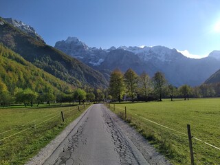 Scenic Mountain Road with Valley and Alpine Peaks