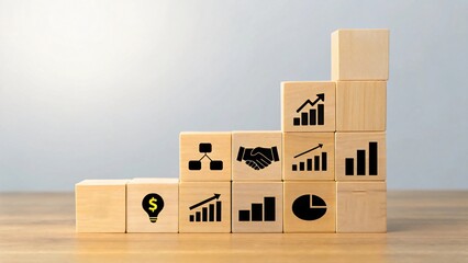 Wooden blocks with business icons arranged in steps