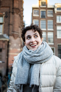 The Netherlands, Amsterdam, Girl with short hair in the city