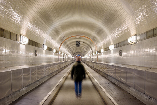 Germany, Hamburg, man walking in Old Elbe Tunnel