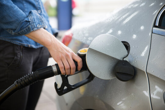 Woman fuelling car