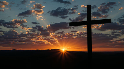 Obraz premium Majestic Sunset Behind a Cross Silhouette in the Sky