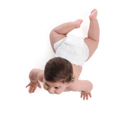 Cute little baby crawling on white background, above view