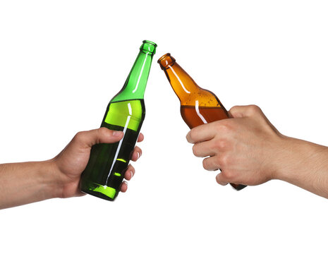 Men clinking their bottles of beer together against white background