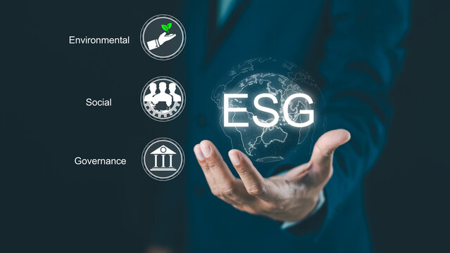 A person presents ESG (Environmental, Social, Governance) concepts with icons representing sustainability and corporate responsibility on a digital global interface.
