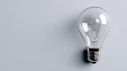 Clear lightbulb on light gray background