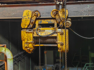 An aged industrial crane hangs overhead, capturing a moment of history.