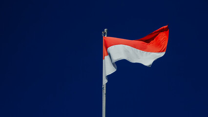 Indonesian Flag against blue sky