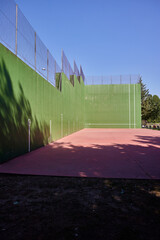 Fronton. A fronton court for playing pelota. It's located in the sports area of a small town.