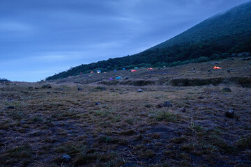 Scenic morning Camping Set Amongst Mountains, Gede Pangrango, and Nature Surya Kencana in a Peaceful Wilderness