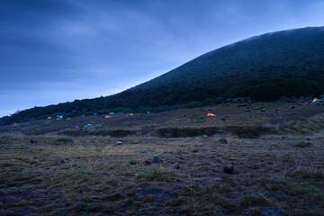 Scenic morning Camping Set Amongst Mountains, Gede Pangrango, and Nature Surya Kencana in a Peaceful Wilderness