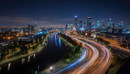 City skyline at night with blurred traffic trails