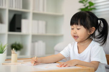 Happy Asia children learning and enjoy paint. family is happy and excited in the house. Mother and daughter having fun spending time together. Holiday, Activity, Executive Function, IQ, EQ