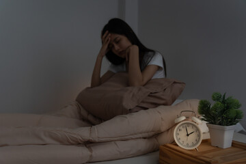 asian woman in bed late trying to sleep suffering insomnia, sleepless or scared in a nightmare,...