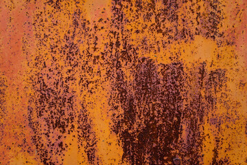 Cracking paint surface and rust-covered metal surface.
