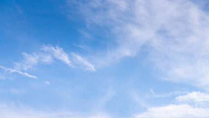 The sky is a vibrant, cloudless blue, while the sun shines brightly, making it appear even more radiant.