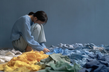young girl crawling on her knees is crying against clean solid color background