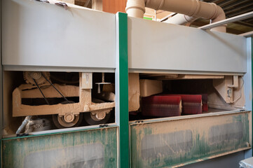 Grinding of wooden furniture panels on a machine. Furniture production concept