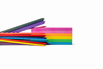 rainbow rubber eraser and pencil lead crayons isolated on a white background