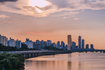 Yeouido, the financial district of Seoul, Korea, and the surrounding city scenery taken during the summer sunset