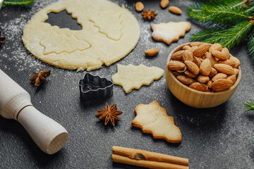 Christmas cookie dough and baking scene with rolling pin, eggs and spices for seasonal preparation concept