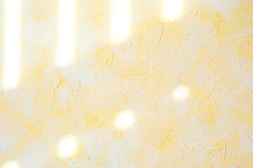 Yellow stucco wall with soft plaster texture and pastel surface