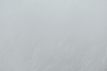 Cloudy sky with a soft gray hue over a tranquil landscape during late afternoon