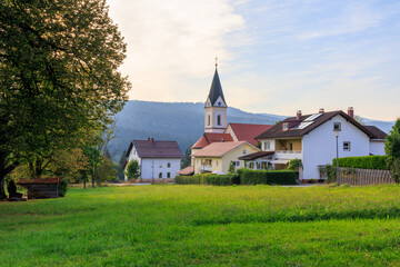 Parish church of the Sacred Heart of Jesus in village Ludwigsthal (Lindberg) with Bavarian Forest National Park mountain panorama, Germany