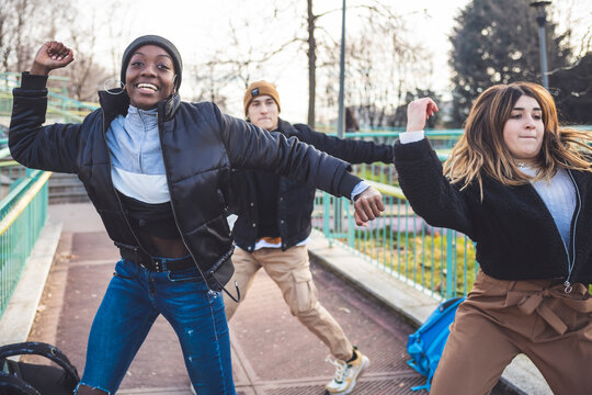 Young dancers rehearsing in a skate park