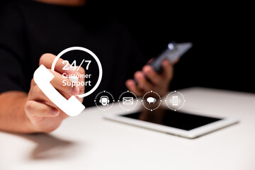 A person holding a smartphone with icons representing 24/7 customer support and communication...