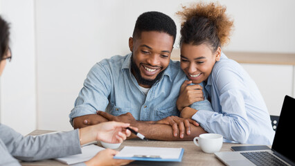 Dream Vacation. Happy African American Spouses Planning Romantic Tour In Travel Agency Office. Panorama, Free Space