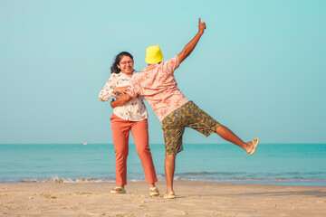 Happy Couple Enjoying Vacation at Goa Beach &ndash; Fun, Laughter, and Playful Moments on a Tropical Shore
