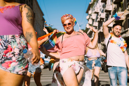 Young male and female activists protesting for equal right on sunny day