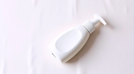 white cosmetic squeeze bottle with pump cap on fabric background for beauty and skincare packaging mockup