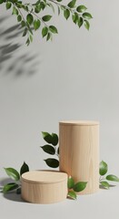 Natural wood pedestals with green leaves and soft shadows
