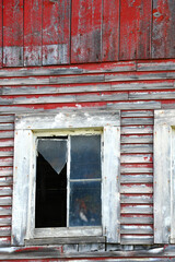 Broken Window Pane on Red Wooden Barn