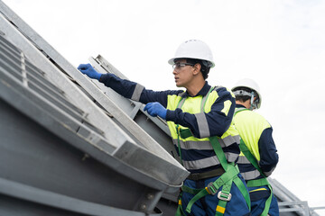 Induced draft cooling towers. Engineer or technicians maintenance and repair of cooling towers on rooftop of building