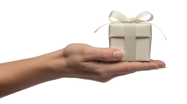 Hand holding a gift box with ribbon isolated on a transparent background image