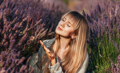 Girl in Lavender Field Smelling Purple Flowers