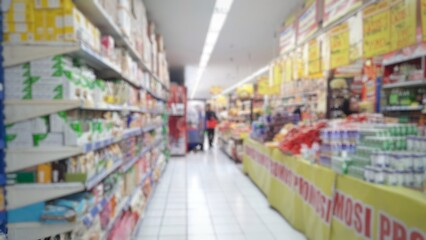Abstract blurred background inside of the supermarket grocery store and shelves
