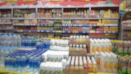 Abstract blurred background inside of the supermarket grocery store and shelves