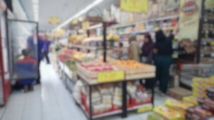 Abstract blurred background inside of the supermarket grocery store and shelves
