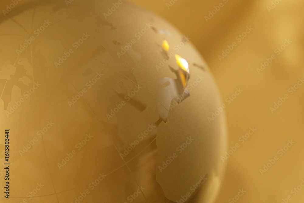 Poster abstract gold textured background image of a globe. perfect for websites and presentations.