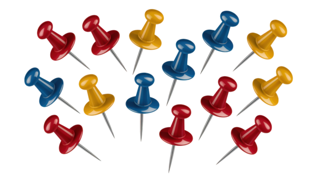 Red blue yellow pushpins scattered isolated on a transparent background thumbtacks