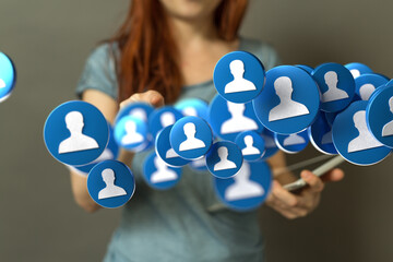 Image of a woman connecting with a network of people using a digital interface.